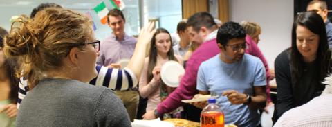 Employees enjoying a pizza party